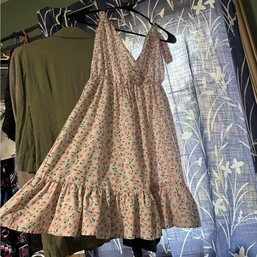 White mini sundress with pink and green floral details